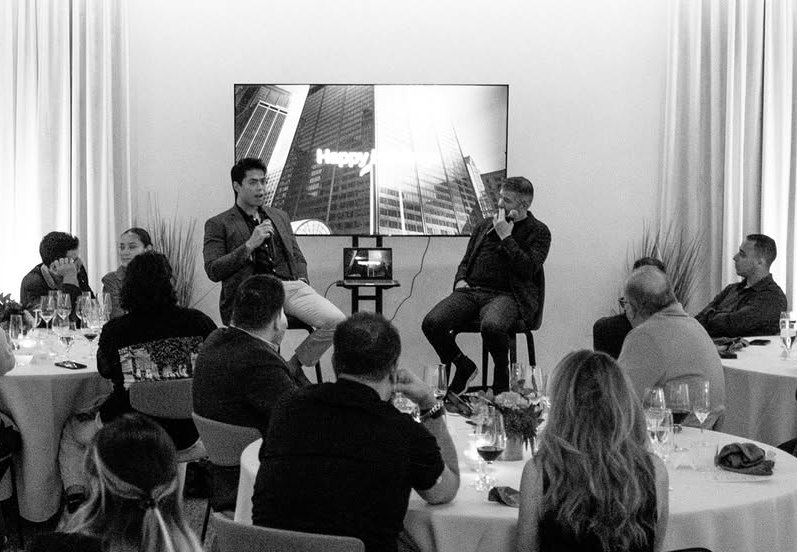 Wesley Li speaking on stage alongside Travis Kalanick, founder of Uber and CloudKitchens